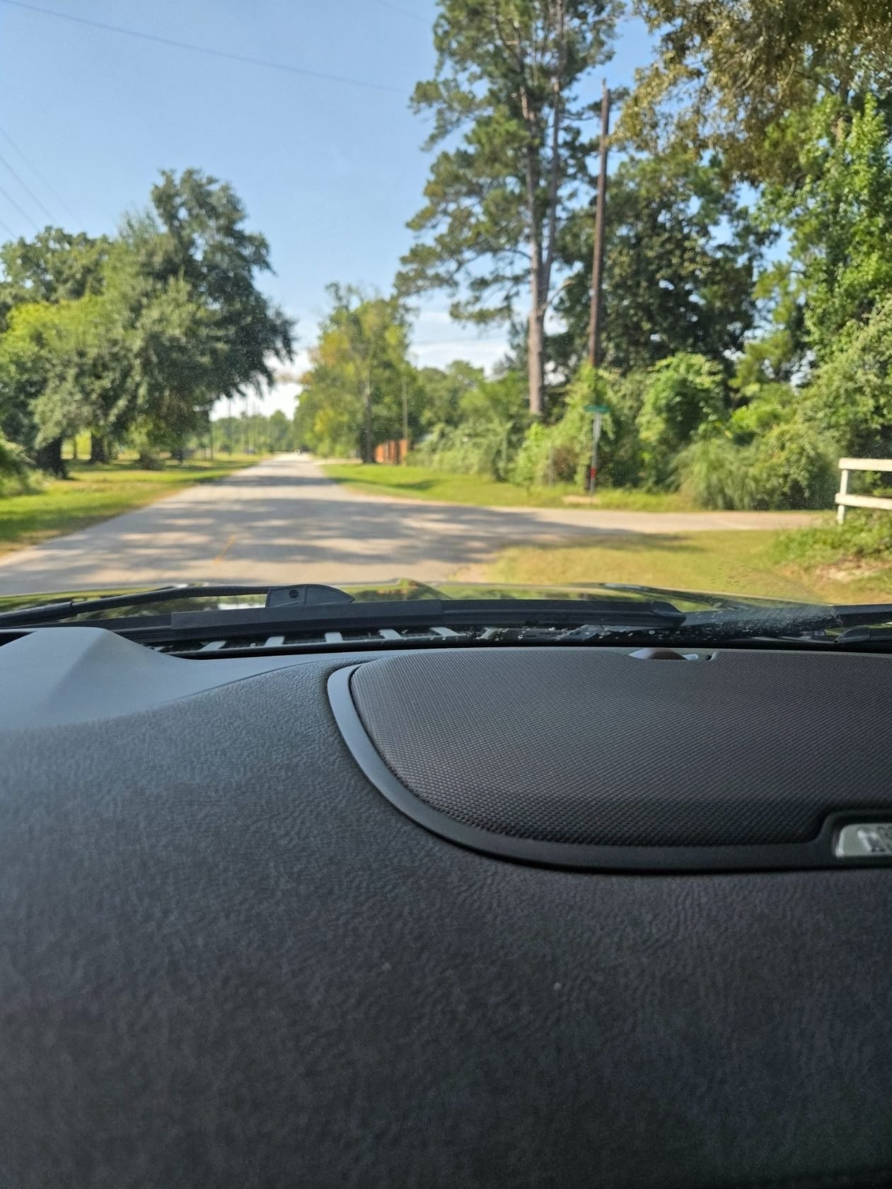Quiet country road between properties in Montgomery County, Texas