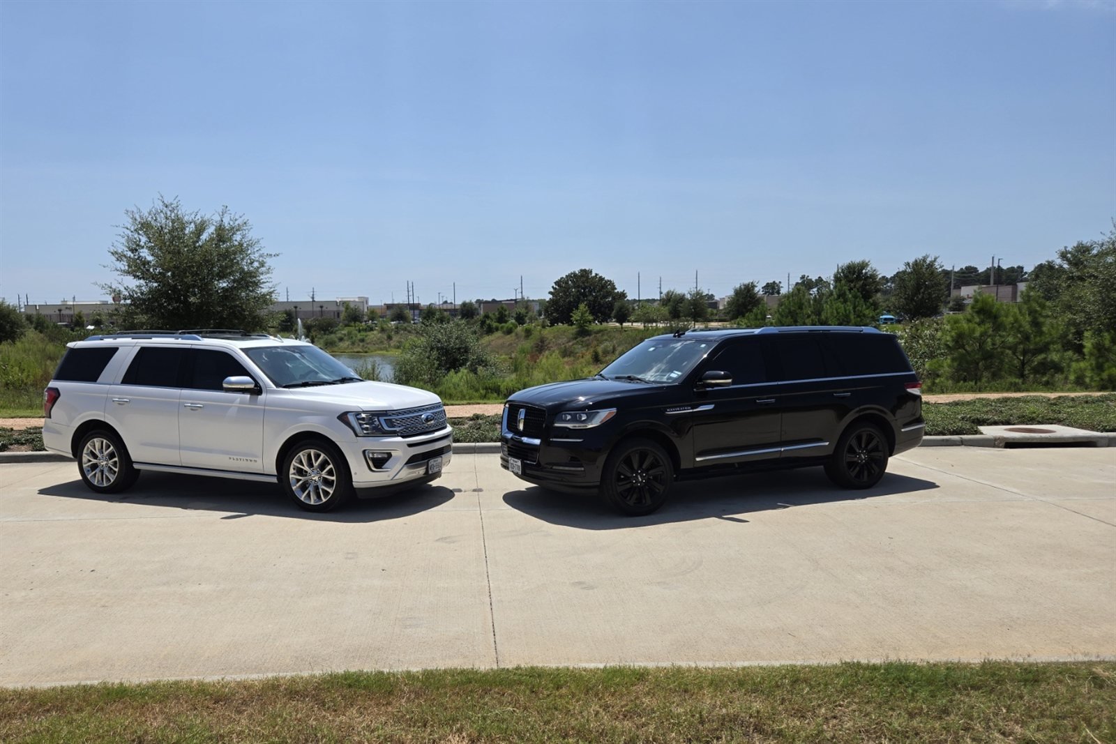 Greg's Blackline white Ford Expedition Platinum and black Lincoln Navigator, side by side